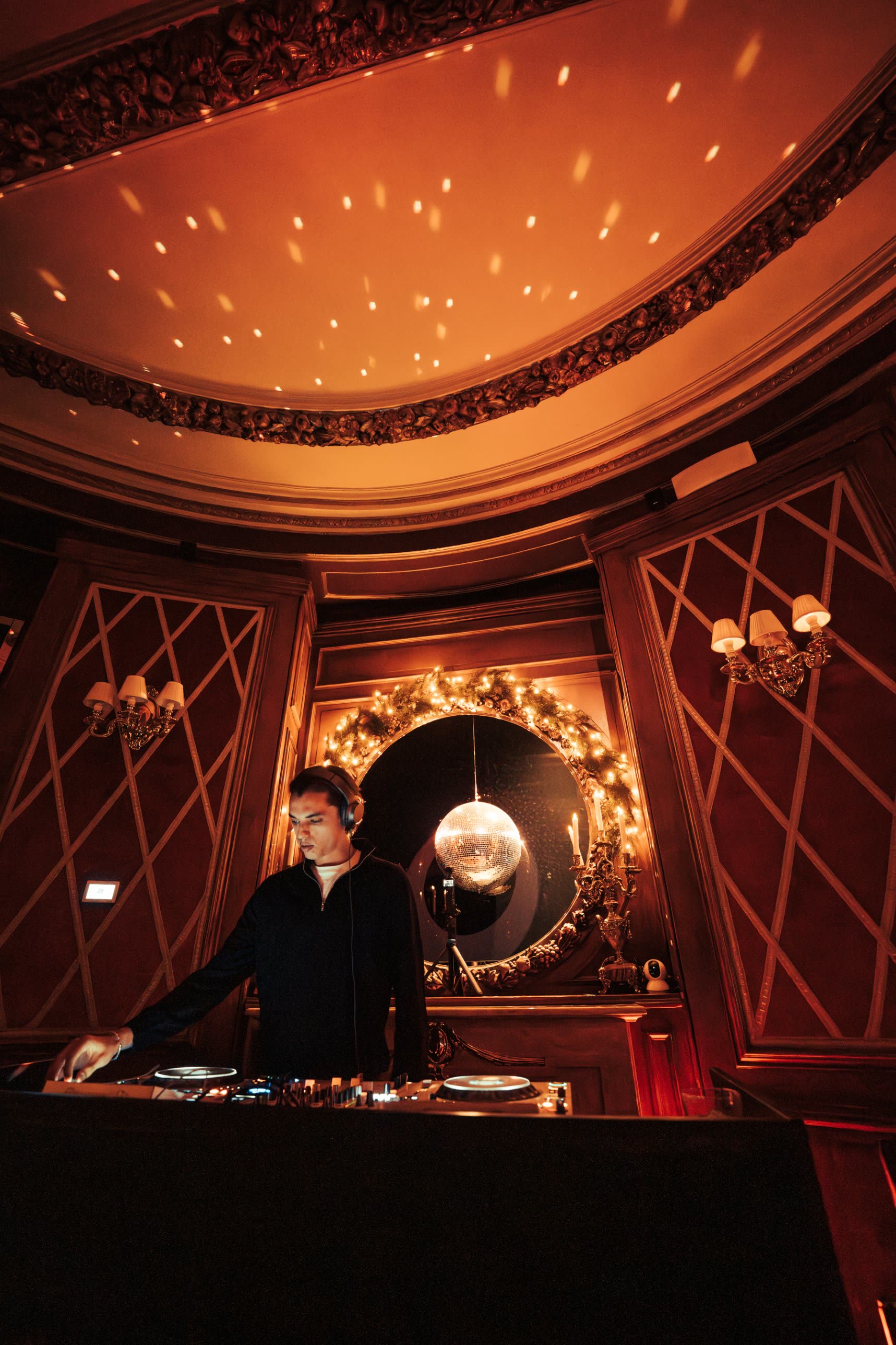 Low angle of ARGANA at the decks beneath an ornate ceiling